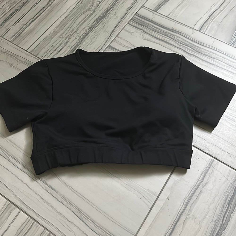 black nvgtn open back crop top
